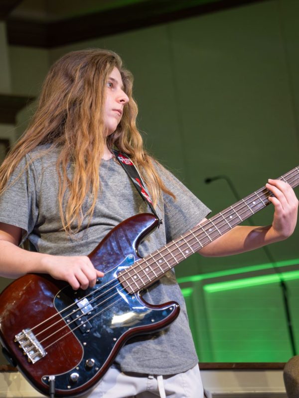 Kid Playing Bass At Red Dirt Music Academy